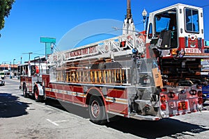 Big red fire engine standing on the road. Big fire truck ready to help in any emergency.