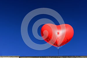 Big Red Heart Balloon With Clear Blue Sky Background