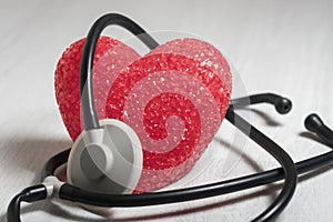 The big red heart is wrapped in a stethoscope