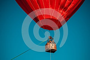 Big red hot air balloon against the blue sky