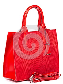 Big red leather woman's handbag isolated on white background