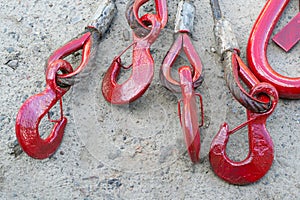 Big red lifting crane hooks on gray background