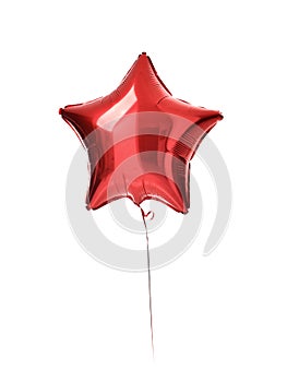 Big red metallic latex star balloon for birthday party isolated on a white