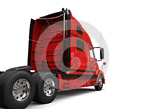 Big red modern semi - trailer truck - back view