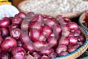 Big red onions in the basket for sell