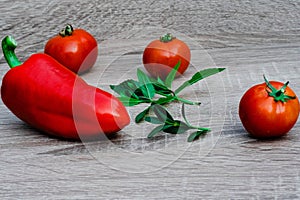 big red pepper, three red tomatoes and mint, objective photography