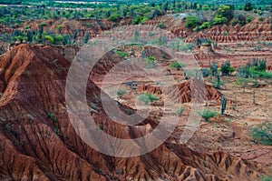 Big red sand stone hill in dry hot tatacoa desert photo