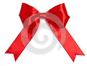 Big red satin gift ribbon bow, isolated on white background, top view