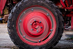 Big red wheel of the tractor
