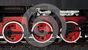 Big red wheels of an old steam locomotive