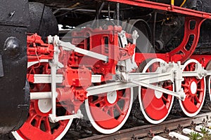 Big red wheels of vintage old steam engine