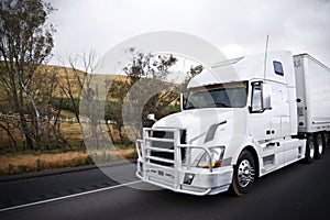 Big rig semi truck with grille protection bumper transporting se