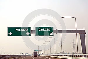 road sign on the Italian motorway for the cities called MILANO a photo