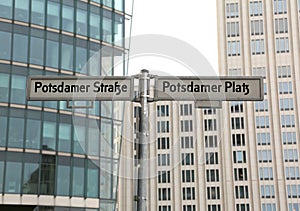 Big road signs with street name of Potsdamer Strasse and Platz t