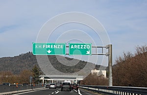 big road signs to Florence or Arezzo in Tuscany Region in Italy photo