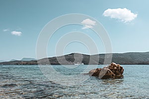Big rock in blue Ionian sea view on Lefkada Greece