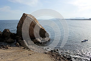 A big rock or hill that is called `The Snorer` in the sea in Ãguilas, a village of fishers of the Mediterranean Sea, in Spain