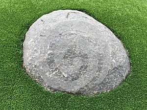 A big rock on lawn