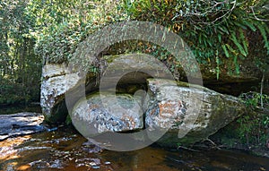 Big rock over the waterway.