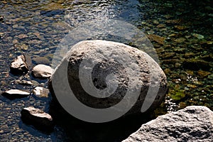 Big rock from a rocky beach in Correntoso Lake