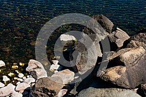 Big rocks on a Nahuel Huapi Lake beach