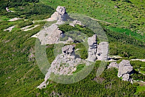 Big rocky vertical boulders on summer mountain