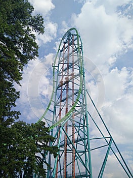 Big roller coaster in an amusement Park. High- speed attraction on the rails.