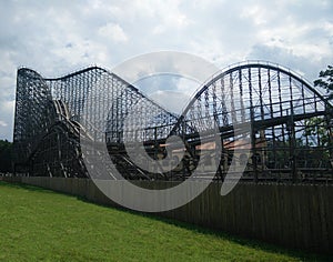 Big roller coaster in an amusement Park. High- speed attraction on the rails.