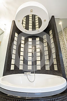Big round bath in cristal bathroom photo