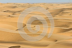 Big sand dunes panorama. Desert or beach sand textured background.