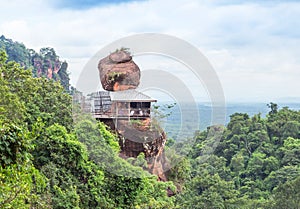 Big sandstone stand on cliff mountain in wat Phuthok or wat Jatiyakeeree viharn Bueng Kan Province, Thailand