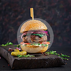 Big sandwich - hamburger burger with beef, tomato, basil cheese