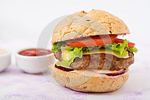 Big sandwich - hamburger with juicy beef burger, cheese, tomato, and red onion