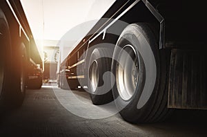 Big Semi Trailer Truck Wheels Tires. Rubber, Wheel Tyres. Trucks on Parking. Freight Trucks Transport Logistics