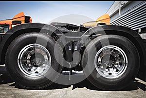 Big Semi Truck Wheels Tires. Rubber, Vechicle Tyres. Freight Trucks Cargo Transport. Auto Repair Service Shop photo
