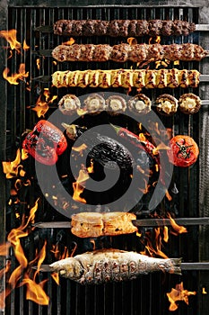 Big Set of Grilled Lule Kebab, Whole Barbecue Vegetables and Fish