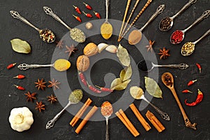 Big set of Indian spices on wooden table. Top view, Horizontal image.