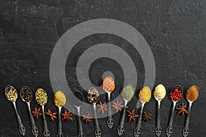 Big set of Indian spices on wooden table. Top view, Horizontal image.