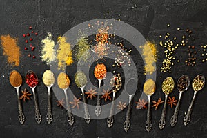 Big set of Indian spices on wooden table. Top view, Horizontal image.