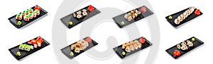 Big set of Sushi Roll - Maki Sushi on black plate isolated over white background.