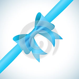 Big shiny blue bow and ribbon on white background