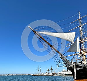 Big Ship Head with Sailcloth in the sea under blue sky