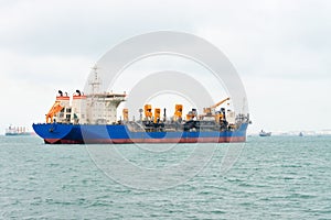 Big ship on the sea near a port