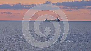 Big ships loaded with cargo sailing at sunset, goods export, Black Sea commerce