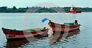 Big and small boats parked in the karaikal beach.