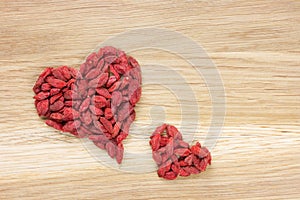Big and small heart shape made of goji berries