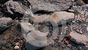 Big and small stones in water