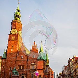 Big soap bubble on an old european city tower background