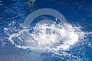 Big Splash in Dark Blue Water