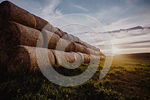 Big stacks of hay on a field